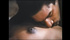 Dazzling lady makes conversation with guy while topless in bed.