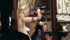 Blonde hottie gets dressed after being asked to by armed bandit.