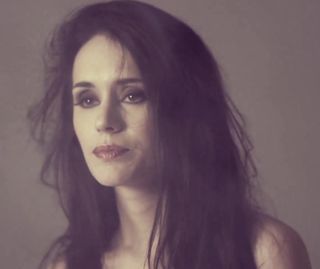 petite long-haired brunette enjoys