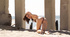 Petite brunette teen has fun on the beach showing her bubble-butt