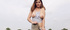 Busty long-haired teen enjoys day outdoors and shows her fine boobs