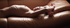 Curly-haired blonde poses naked seductively touching tight body