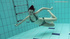 Tall Russian brunette filmed swimming naked underwater