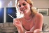 Before masturbating for you with a heavy vibrator, a lovely blonde smokes a cigarette.