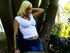 A short jean skirt looks great on a blonde's ass as she's outside smoking her ciggy.