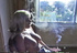 Serious lass smokes a cig while watching a woman suck off a rock hard dick.