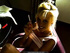 Cutie's white tank is pulled up to reveal a great rack while she takes drags off her cig.