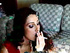 Whore in a sexy ensemble fills her living room with the smell of her sex and ciggy smoke.