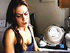 Ponytailed brunette housewife loves smoking while washing up and reading