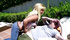 A rocker blonde with tattoos wakes up a sleeping sunbather and rides him hard