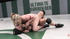 Inked ponytailed wrestler with strap-on teasing her enemy with vibro before nailing