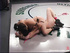 Ponytailed brunette girl drilling her rival's tattooed pussy with strap-o after win