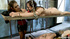 Two brunettes slaves getting used by a lady in stockings