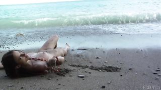 babe lies sand and